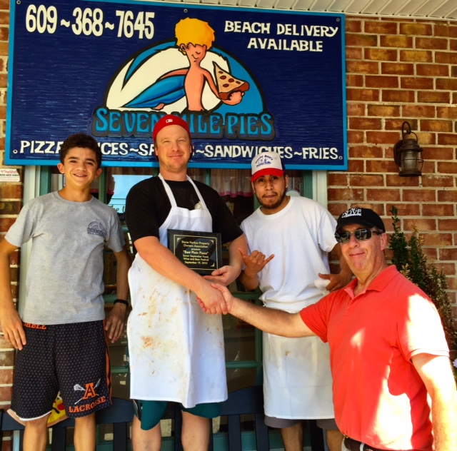 Seven Mile Pies Asst. Regional Manager Ben Friedlander, Chief Pizza Officer Craig Lawson and Head Chef Luis Cruz arte congratulated by SHPOA President Frank Byrne